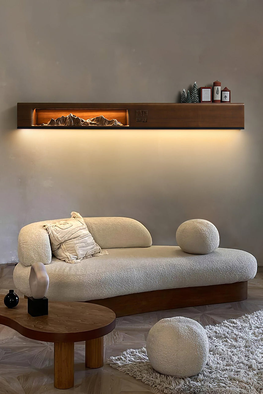 Light wood panel lit above a curved sofa in a plain living room