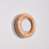 Light wood ring unlit, the white diffuser flat inside the turned rim