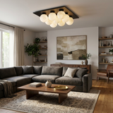 Nine ball alabaster ceiling light in a living room with a corner sofa and shelving
