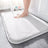 Non-slip bathroom rug installed in a bathroom setting