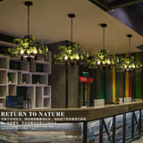 Iron Cage Chandelier with Artificial Foliage Accent