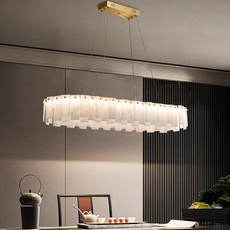 Marble ring chandelier in a room with long curtains