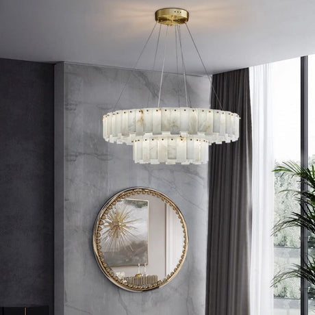 Marble ring chandelier in a room with a tall mirror