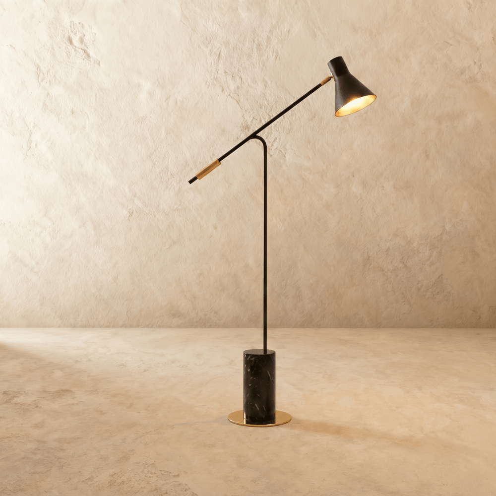 A long angled arm on a slim upright above a dark marble cylinder base