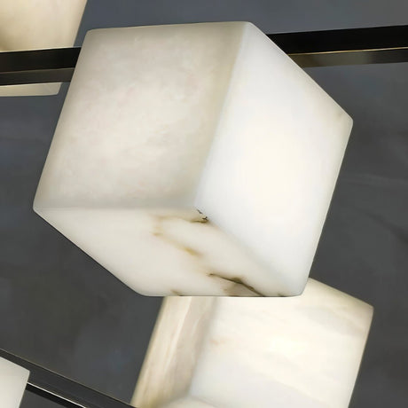 The corner of one alabaster cube, the veining lit from inside the stone