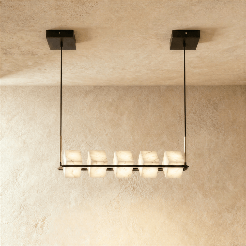 A long black bar carrying five lit alabaster cubes below a rectangular plate