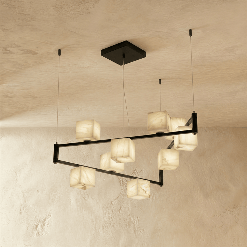 A tall staggered set of lit alabaster cubes spread across two black arms