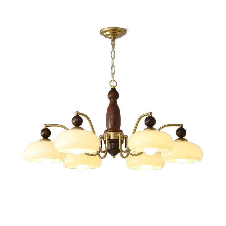 Shallow beige glass domes and the gold arms that carry them