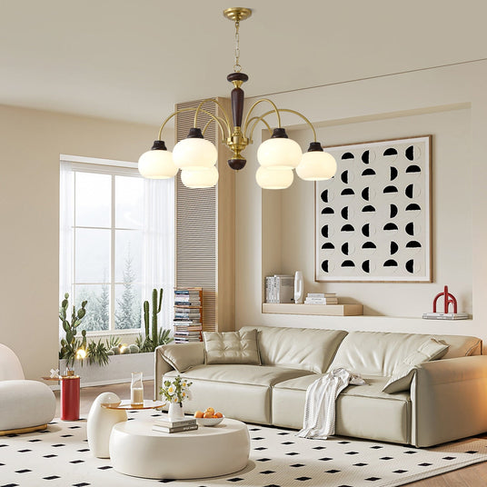 The globes lit over a round coffee table on a patterned rug