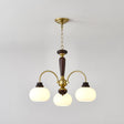 The three light version, three brass arms and three white glass globes
