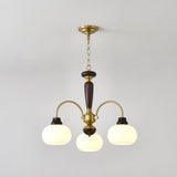 The three light version, three brass arms and three white glass globes