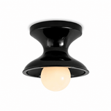 Glossy navy spool ceiling light shown lit on a white backdrop