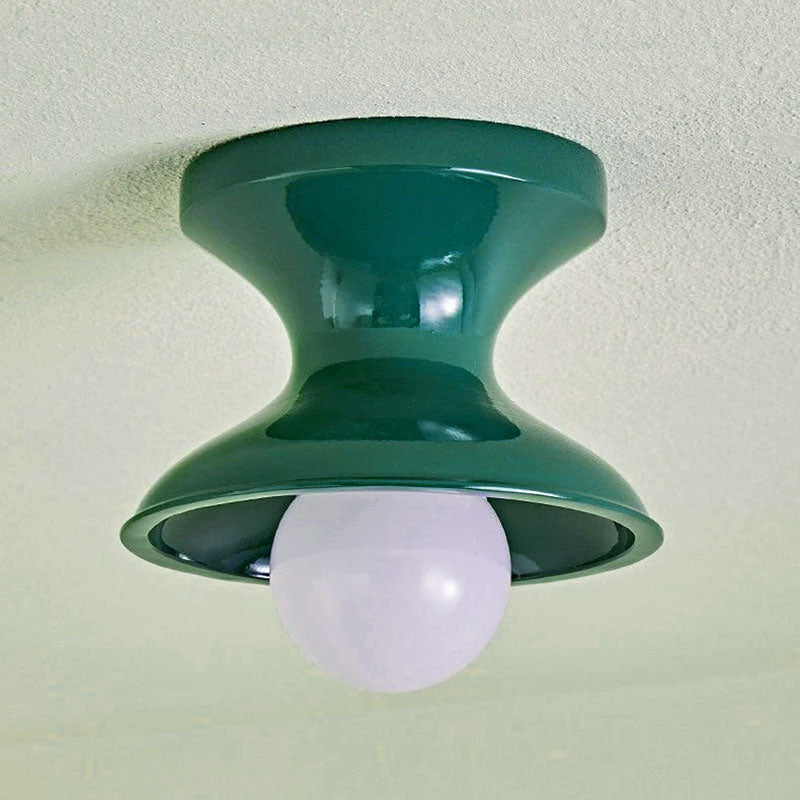 Close view of the green spool ceiling light with a round opal globe