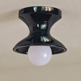 Close view of the navy spool ceiling light seen from below
