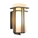 The lantern lit on a white background, showing the stepped bars and the back plate