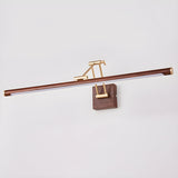 The bar lit on a pale wall, the brass arm folded and the tube glowing below