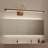 Walnut toned bar lit above a long mirror over a wide vanity with two basins