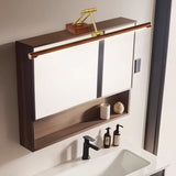 Bar lit above a walnut mirror cabinet over a basin with a black tap