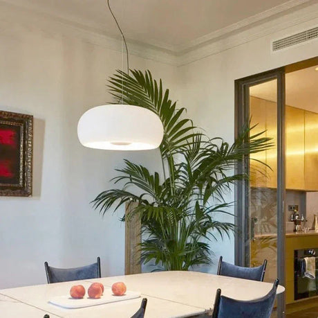 White glass dome above a table in a bright living room