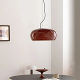Red glass dome above a dark round table