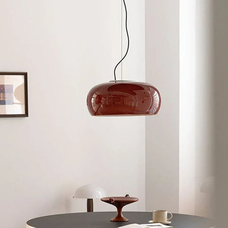 Red glass dome above a dark round table