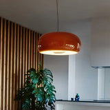 Red glass dome in a kitchen with wooden wall slats