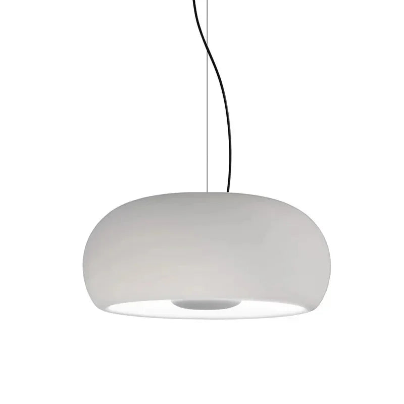 White glass dome shade photographed against a pale ground