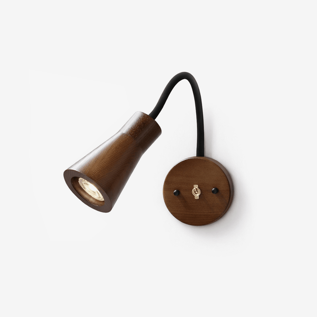Walnut cone head on a black gooseneck arm with a round wood plate