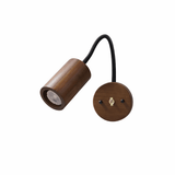 Walnut cylinder head on a black gooseneck arm with a wood wall plate