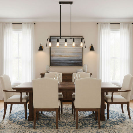 Sconces lit on a dining room wall beside a table, chairs and a window