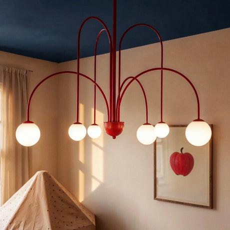 The red arms lit beside a framed apple print under a navy painted ceiling