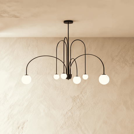 The black frame turned so the arched arms cross and the globes sit at depth