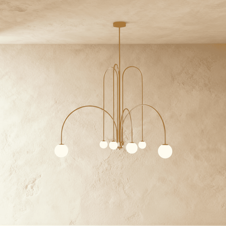 The same arched frame in gold, six opal glass globes hanging at mixed heights
