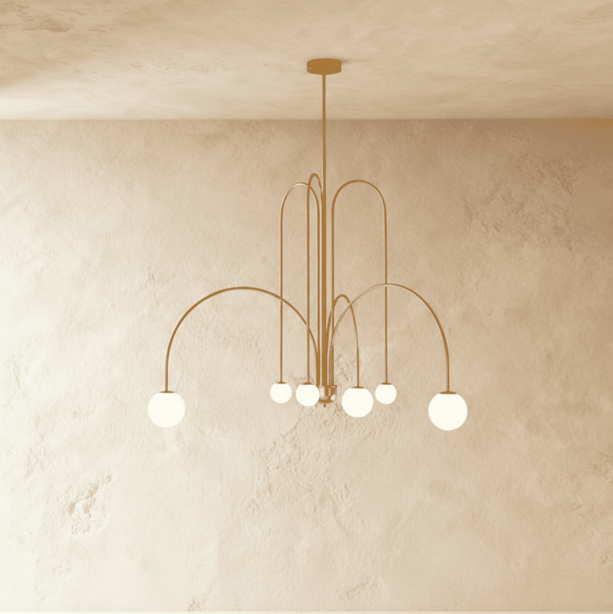 The same arched frame in gold, six opal glass globes hanging at mixed heights