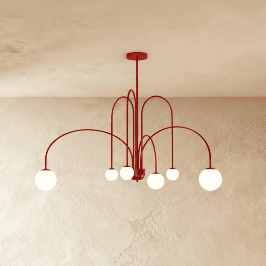 The same arched frame in red, the opal globes lit at the end of each arm