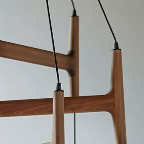 The joint where two walnut bars meet, with the cable anchors seen close