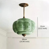 Green shade shown with its 38 cm width and 31 cm height marked on a plain field