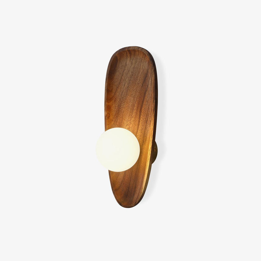 Milk glass wall sconce, an opal globe on a walnut pebble shaped backplate