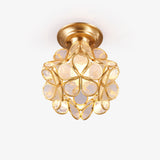 Mini ceiling light with clear glass petals set in a gold plated frame