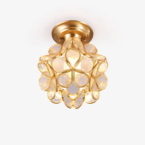 Mini ceiling light with clear glass petals set in a gold plated frame
