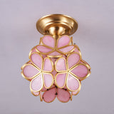 Pink glass petal ceiling light seen from the side