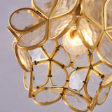 Close view of the gold plated frame holding the glass petals