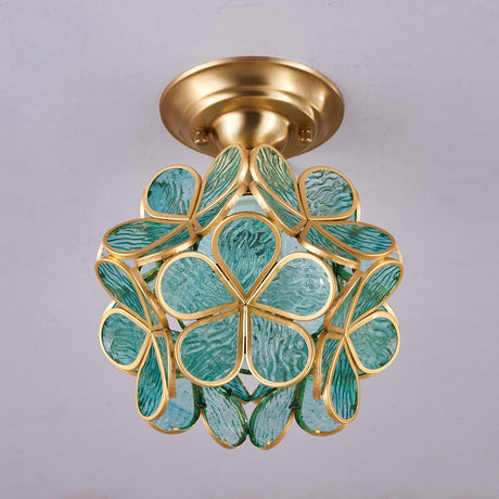 Green glass petal ceiling light seen from below
