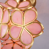 Close view of pink glass petals overlapping in the frame