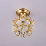 Clear glass petal ceiling light unlit against a plain ceiling