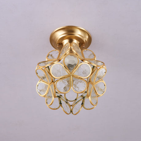 Clear glass petal ceiling light unlit against a plain ceiling