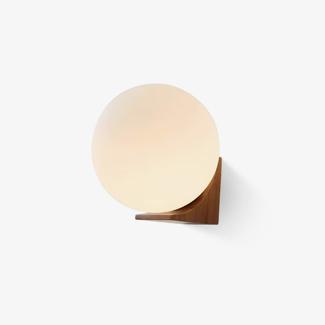 Mini wall sconce, a white glass sphere resting in a small wood bracket