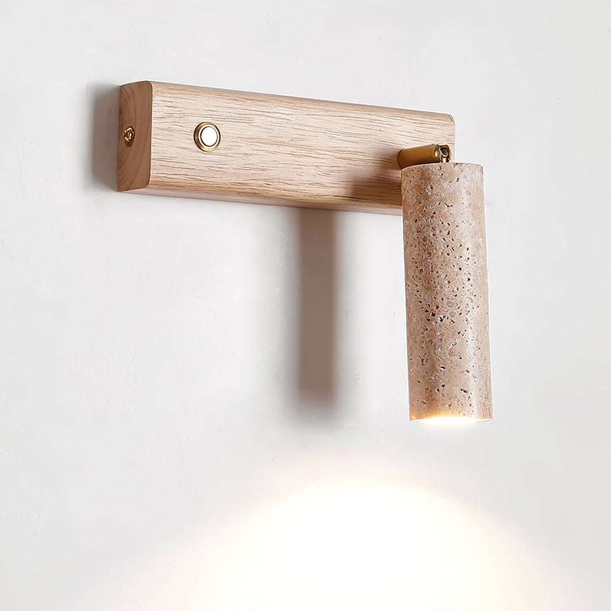 The wood arm extended from the wall with the stone tube angled at its end
