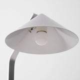 The open underside of the cone shade with the socket in view