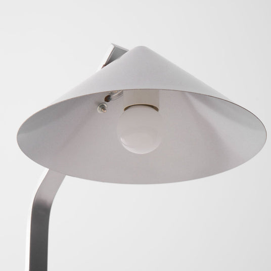 The open underside of the cone shade with the socket in view
